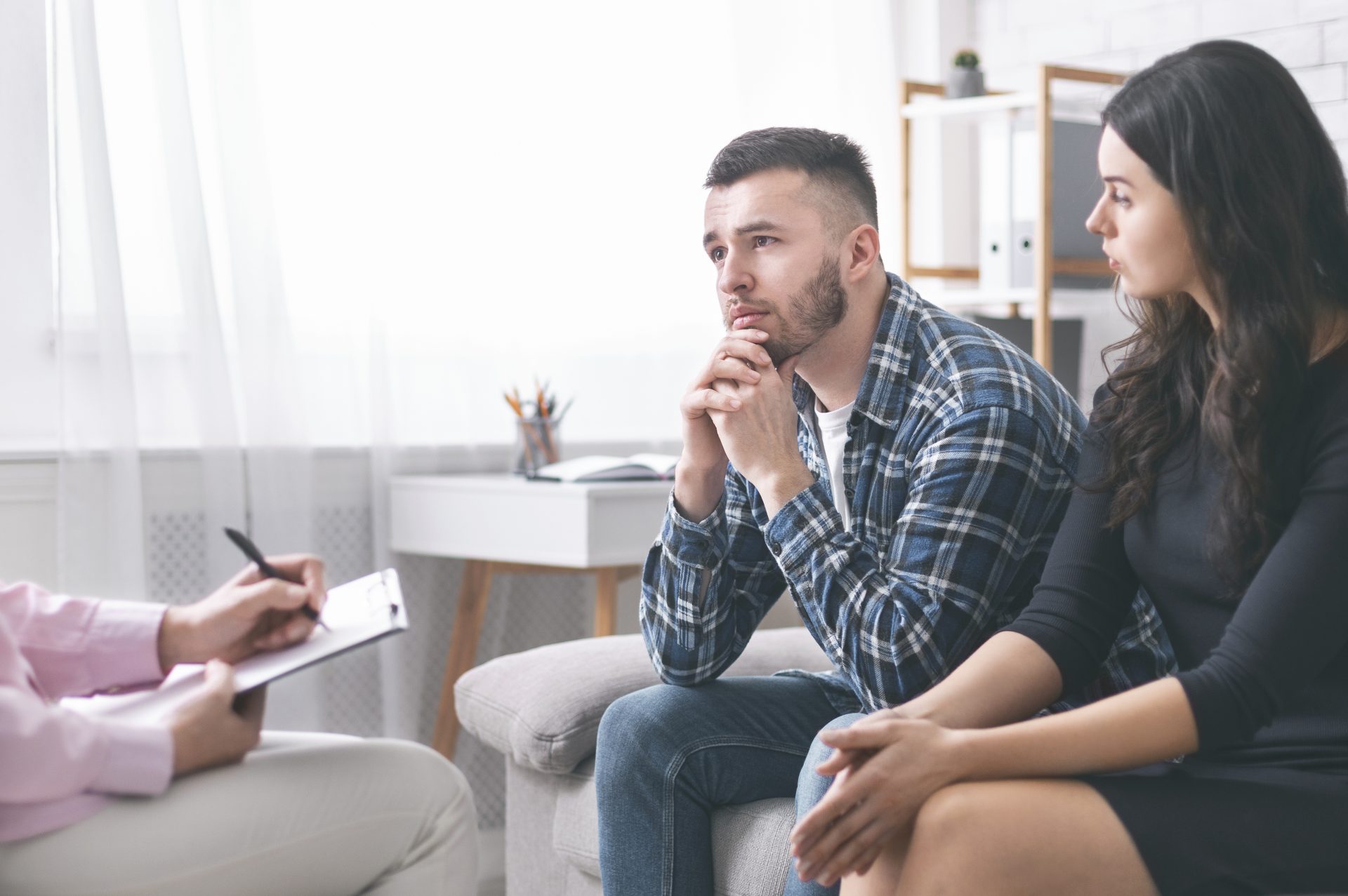 young-grumpy-couple-at-marital-counseling-therapy-2022-12-16-08-21-57-utc