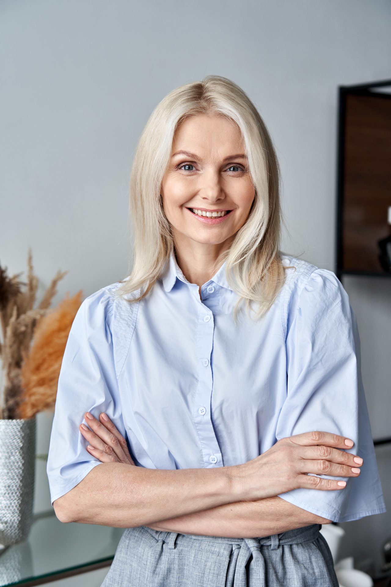 smiling-confident-50s-middle-aged-woman-standing-a-2021-09-02-14-46-47-utc