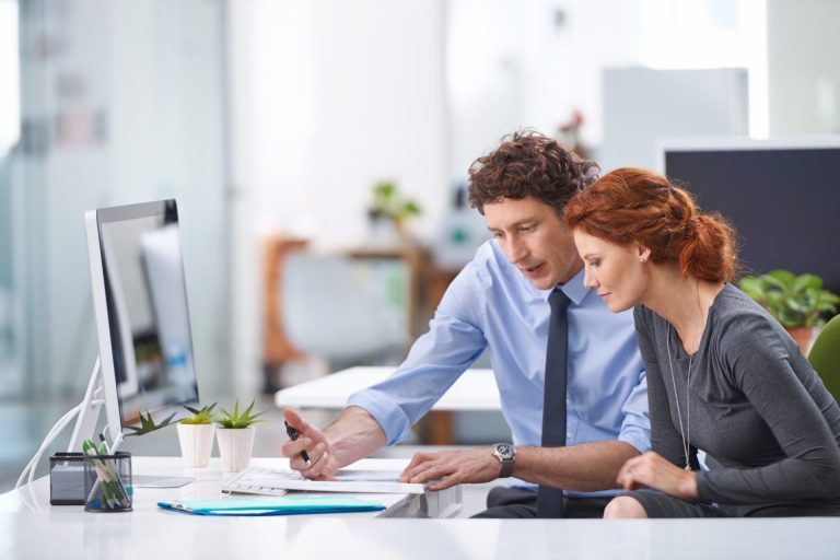 young-business-professionals-discussing-work-docum-2022-09-30-21-54-10-utc